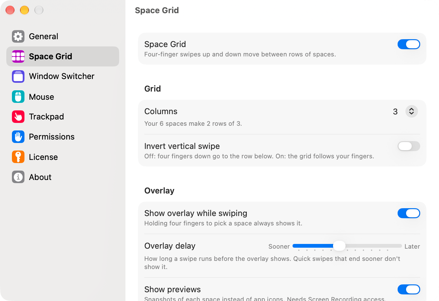 The Space Grid page of the Qesture Settings window, with the switch, the number of columns, and overlay options.